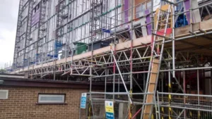 Scaffolding set up along building under renovation